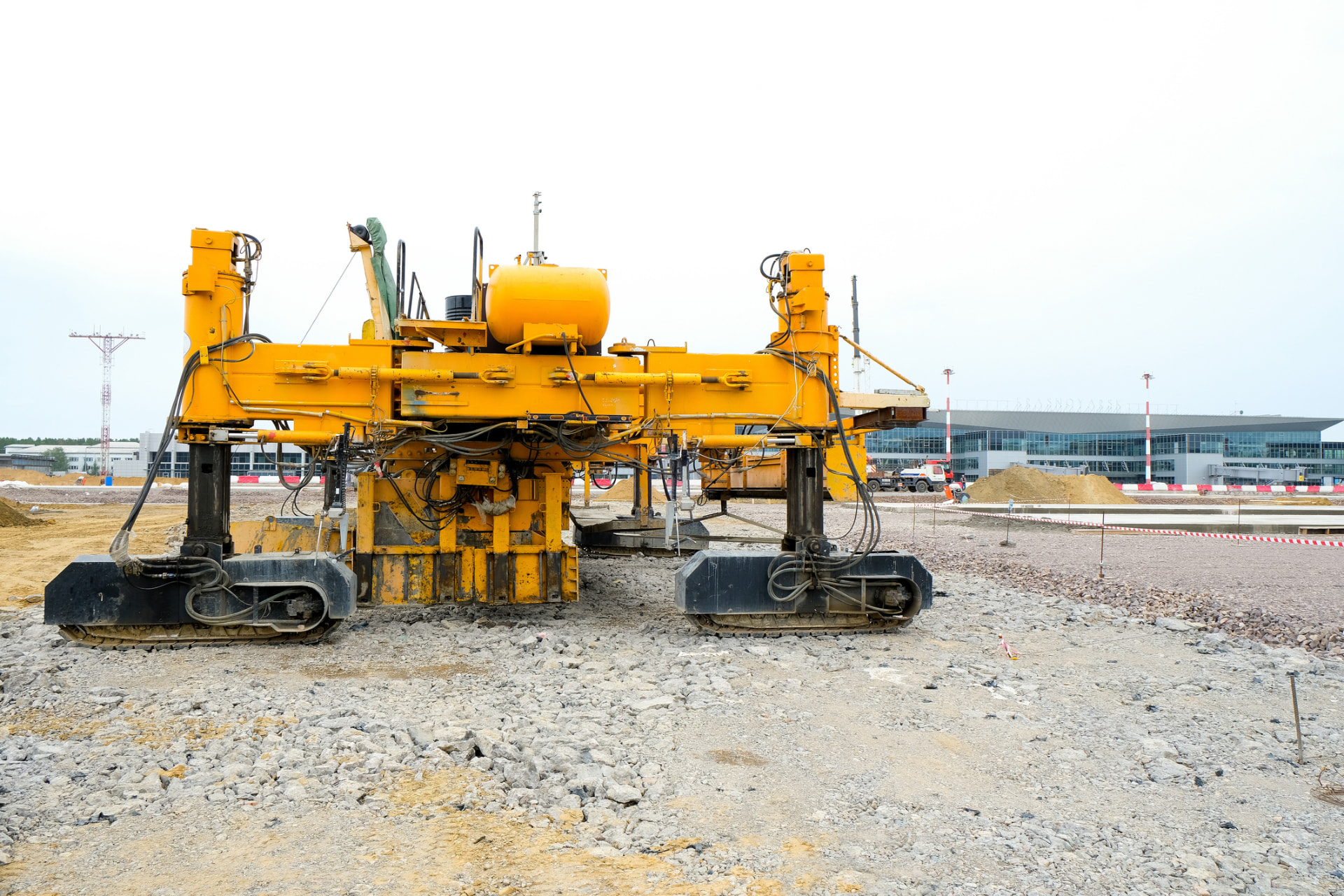 Paving equipment staged on a prepared stone base for a new Shamong surface