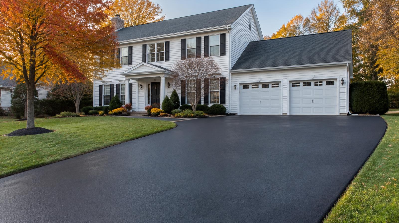 Freshly sealcoated asphalt driveway at a Middletown, NJ colonial home